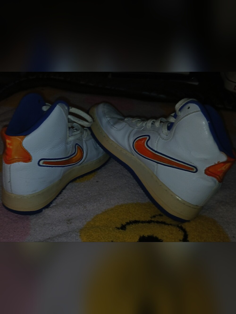 Pre-loved Women's White High-Top Nike Sneakers with Orange Accent.